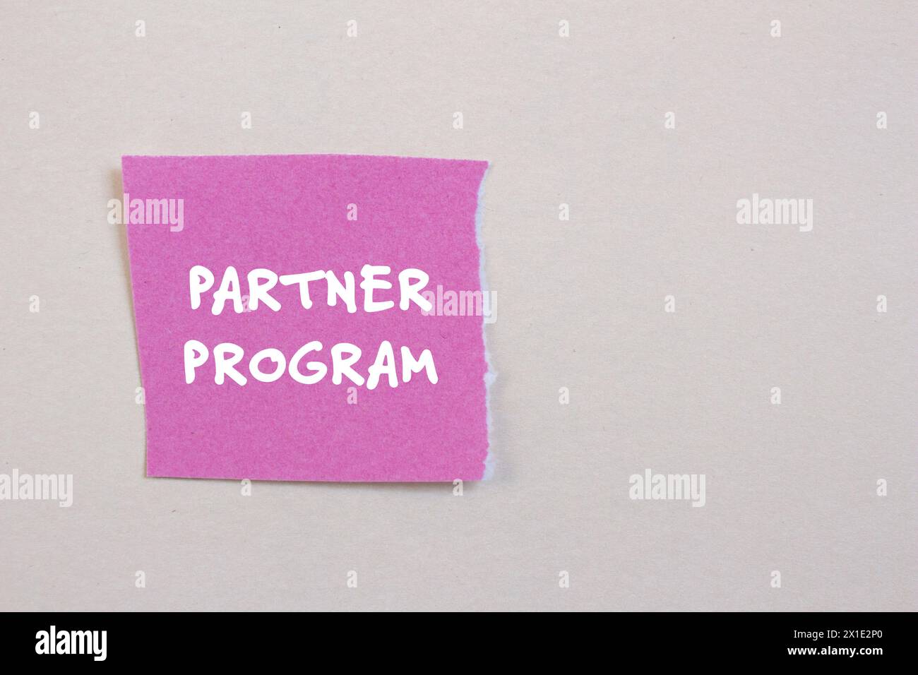 Partner program words written on ripped paper. Conceptual partner ...