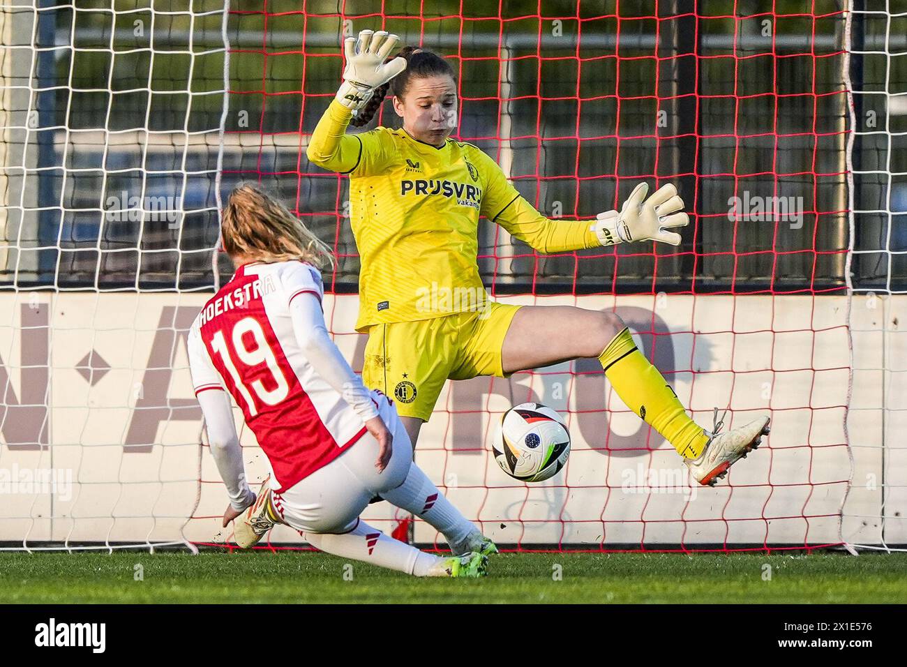 Amsterdam, Netherlands. 16th Apr, 2024. Amsterdam - Tiny Hoekstra of Ajax Vrouwen scores the 1-0 during the match between Ajax V1 v Feyenoord V1 at De Toekomst on 16 April 2024 in Amsterdam, Netherlands. Credit: box to box pictures/Alamy Live News Stock Photo