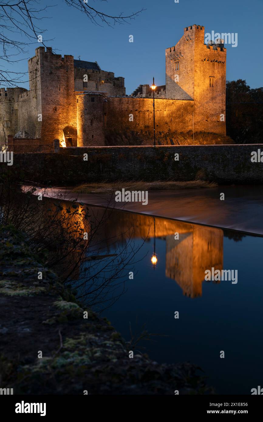 Illuminated view of Cahir castle on the river Suir in Cahir town in Tipperary in Ireland Europe Stock Photo