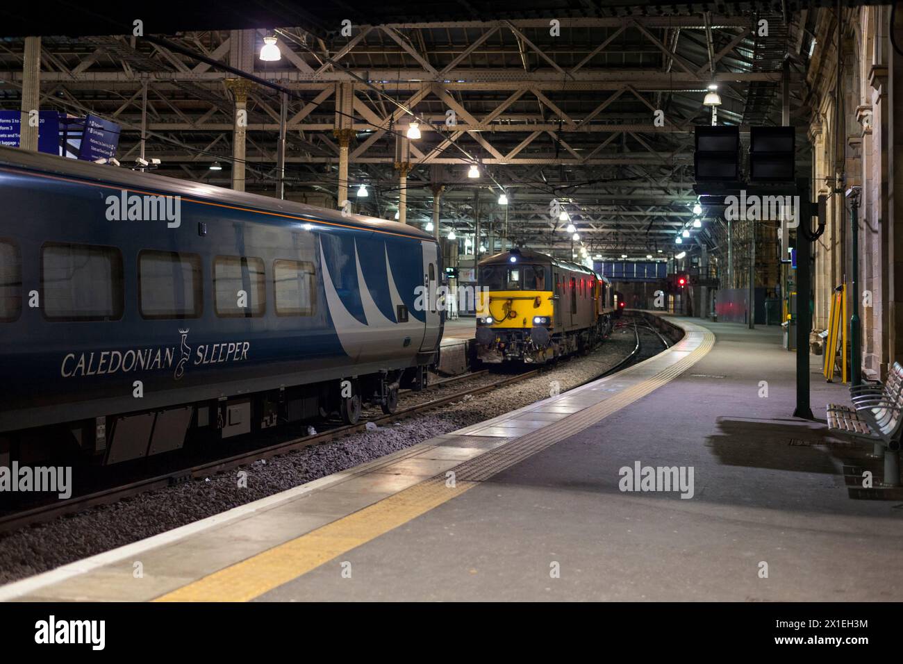 The locomotives for the Inverness portion of  the highland Caledonian sleeper backing on to the train at Edinburgh Waverley at  04.00 in the morning Stock Photo