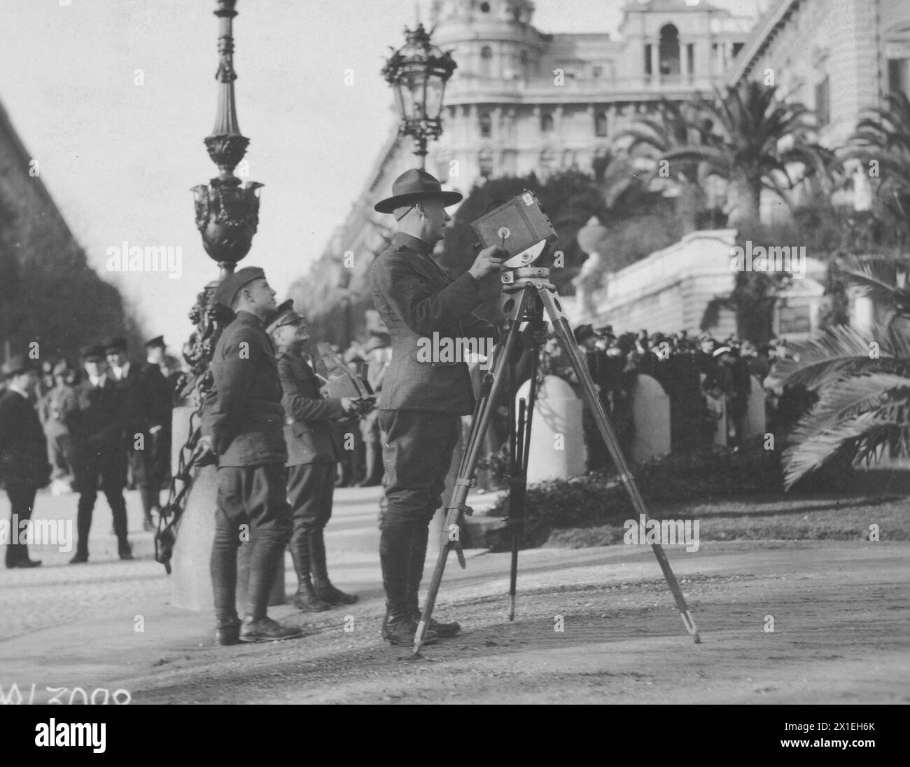 CAMERA MEN OF THE U.S. ARMY, taking photographs of the arrival of President and Mrs. Wilson at Queen Mother's palace. Rome, Italy ca. Jan 1919 Stock Photo