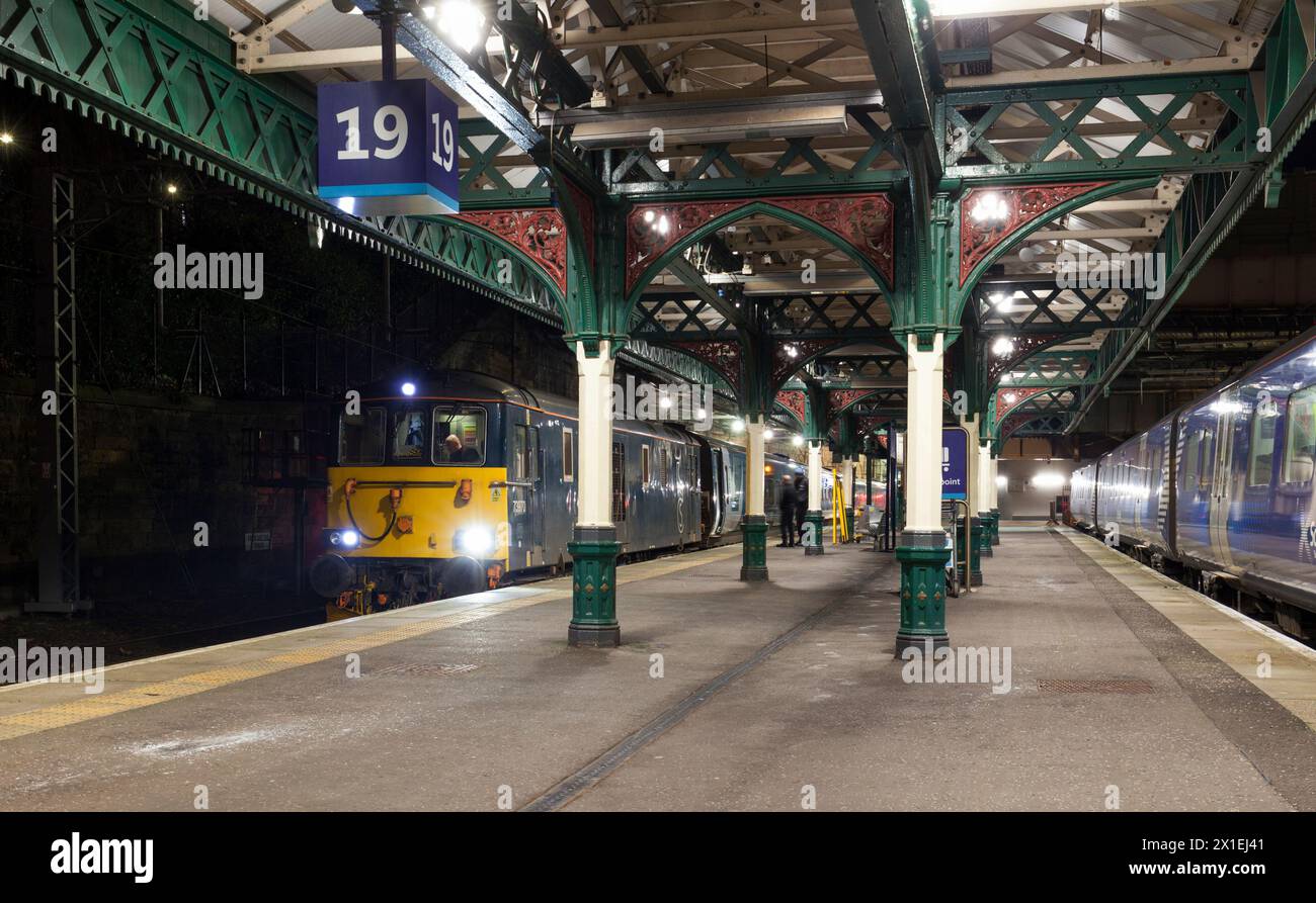 GB railfreight class 73 locomotive at Edinburgh Waverley  waiting with 0439 Edinburgh - Aberdeen portion of 2115 Caledonian sleeper from London Euston Stock Photo