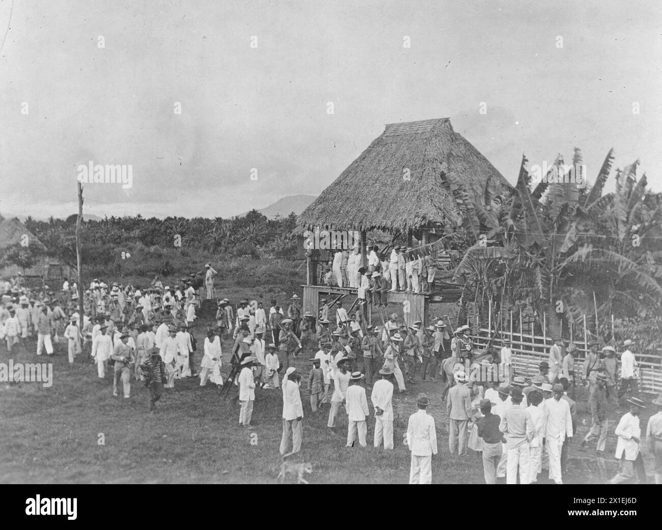 Philippines Islands Insurrection Surrender of Cailles, Santa Cruz, Laguna Province, June 24, 1901, showing insurgents marching in between line of natives. Stock Photo