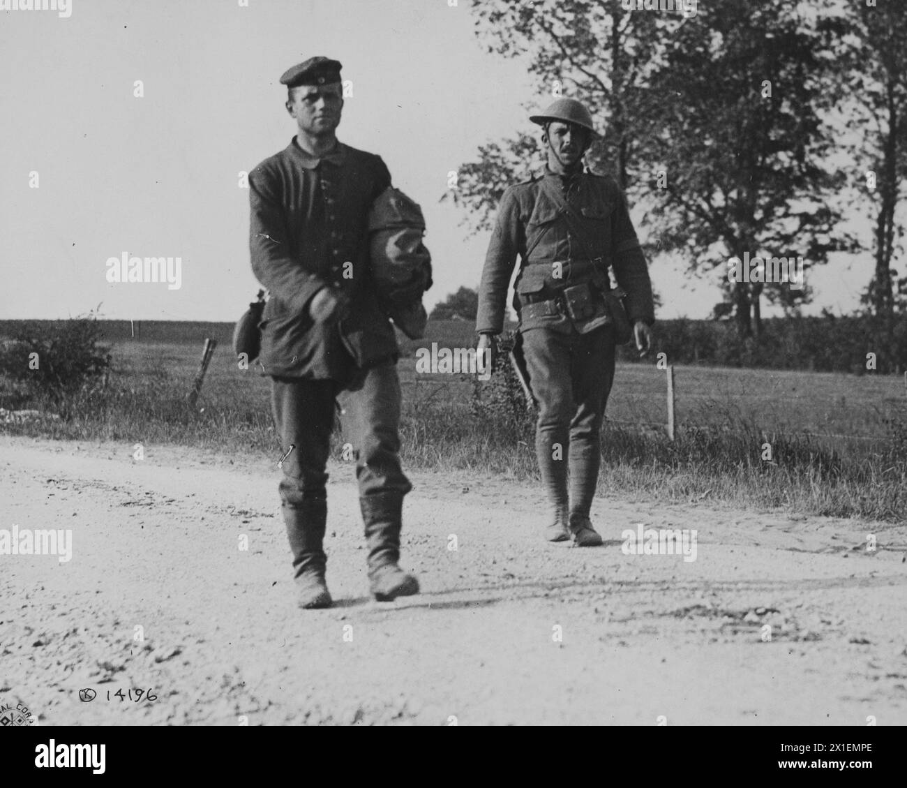 German prisoner of war being taken to 2nd Division headquarters by a soldier of the 5th Marines; Montreuil France ca. 1918 Stock Photo