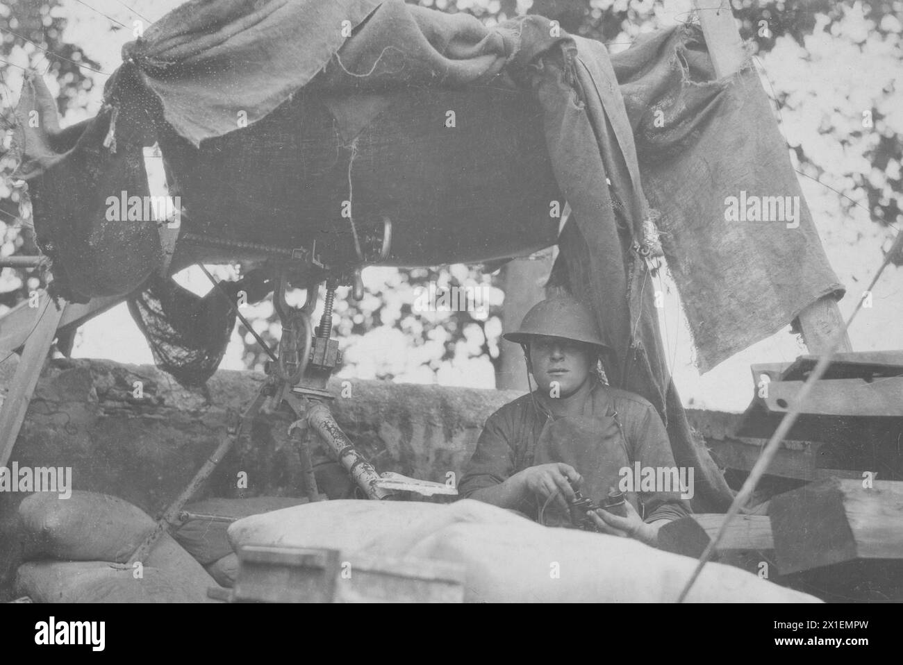 World War I photos: Soldier posted at a machine gun position in a railyard; Company A, 9th Machine Gun Battalion, 3rd Division, Chateau Thierry, France ca. 1918 Stock Photo