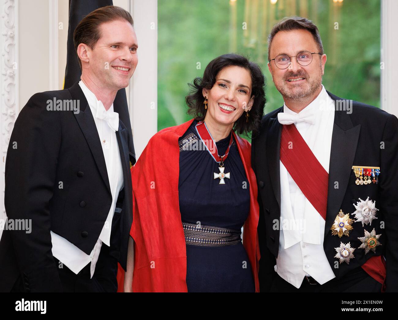 Brussels, Belgium. 16th Apr, 2024. Foreign Minister of Luxembourg Bettel's husband Gauthier Destenay, Belgian Foreign minister Hadja Lahbib and Foreign Minister of Luxembourg Xavier Bettel pictured ahead of a state banquet, on the first day of the official state visit of the Luxembourg royal couple to Belgium, Tuesday 16 April 2024, at the Royal Castle in Laken-Laeken, Brussels. BELGA PHOTO BENOIT DOPPAGNE Credit: Belga News Agency/Alamy Live News Stock Photo