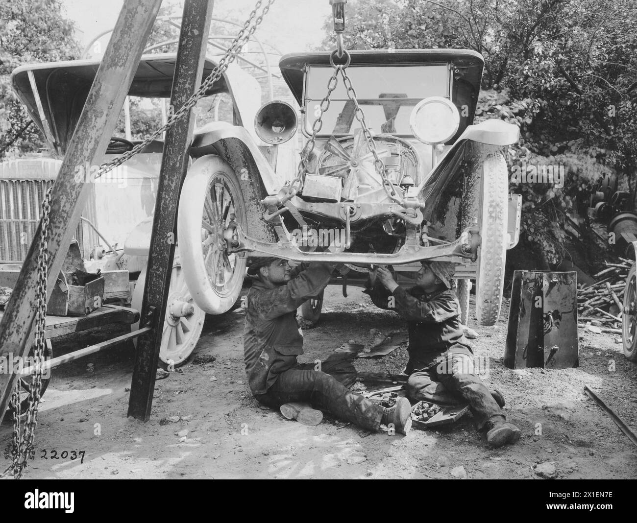 Soldiers of the 309th Truck Unit adjusting new parts on a Dodge motor; Chaumont France ca. 1918 Stock Photo