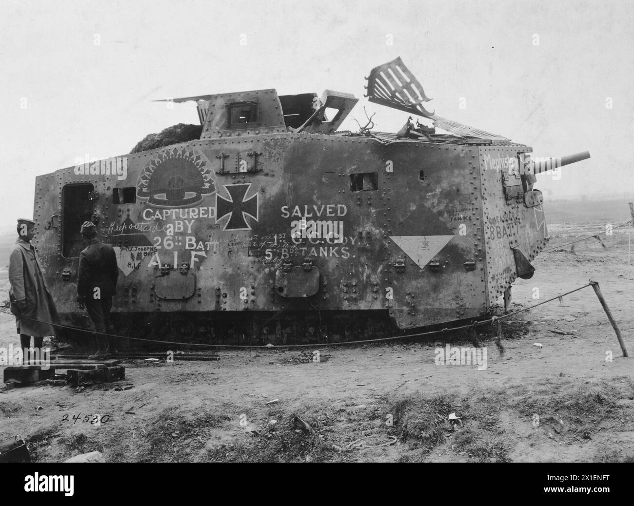 Two soldiers strand in front of a German tank captured by Australian soldiers on July 14, 1918 at Monument Wood  ca. September 1918 Stock Photo