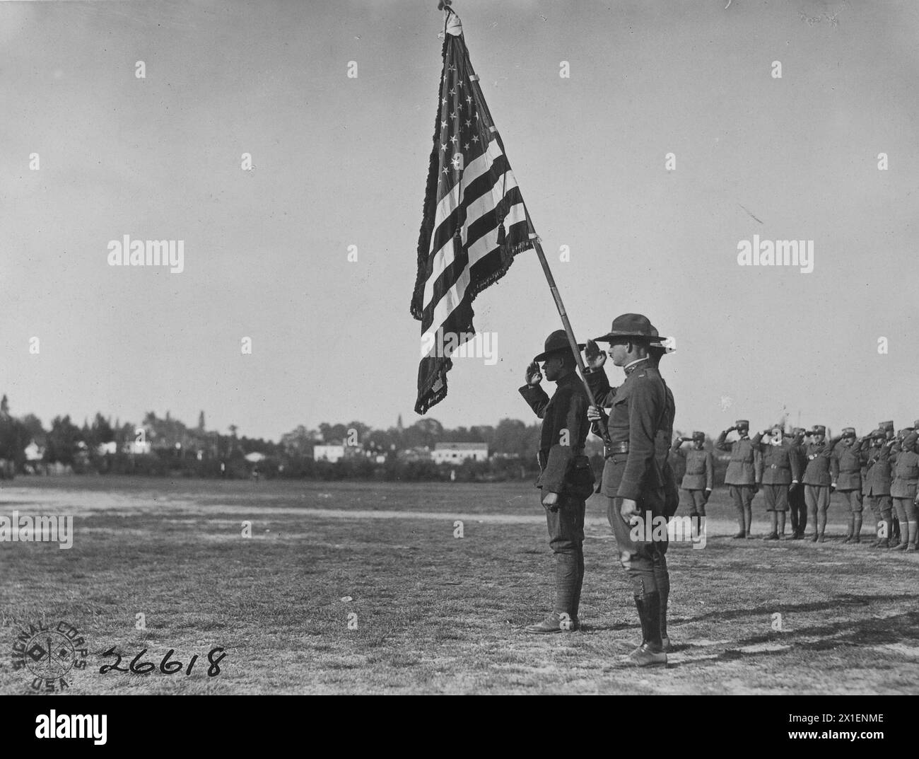 Chaplain Major Doherty presenting colors to officers and NCOs of Company 'I' 332nd Regiment, Infantry. Review grounds at the Italian Rest Camp in Treviso Italy ca. 1918 Stock Photo