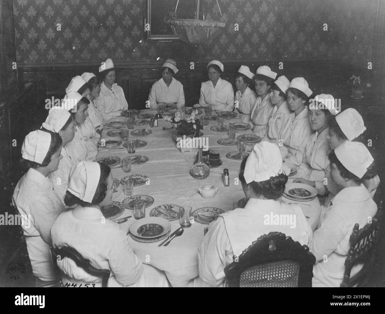 Nurses sit around a table at dinner at the nurses' home; Tours Indre et Loire France ca. 1918 Stock Photo