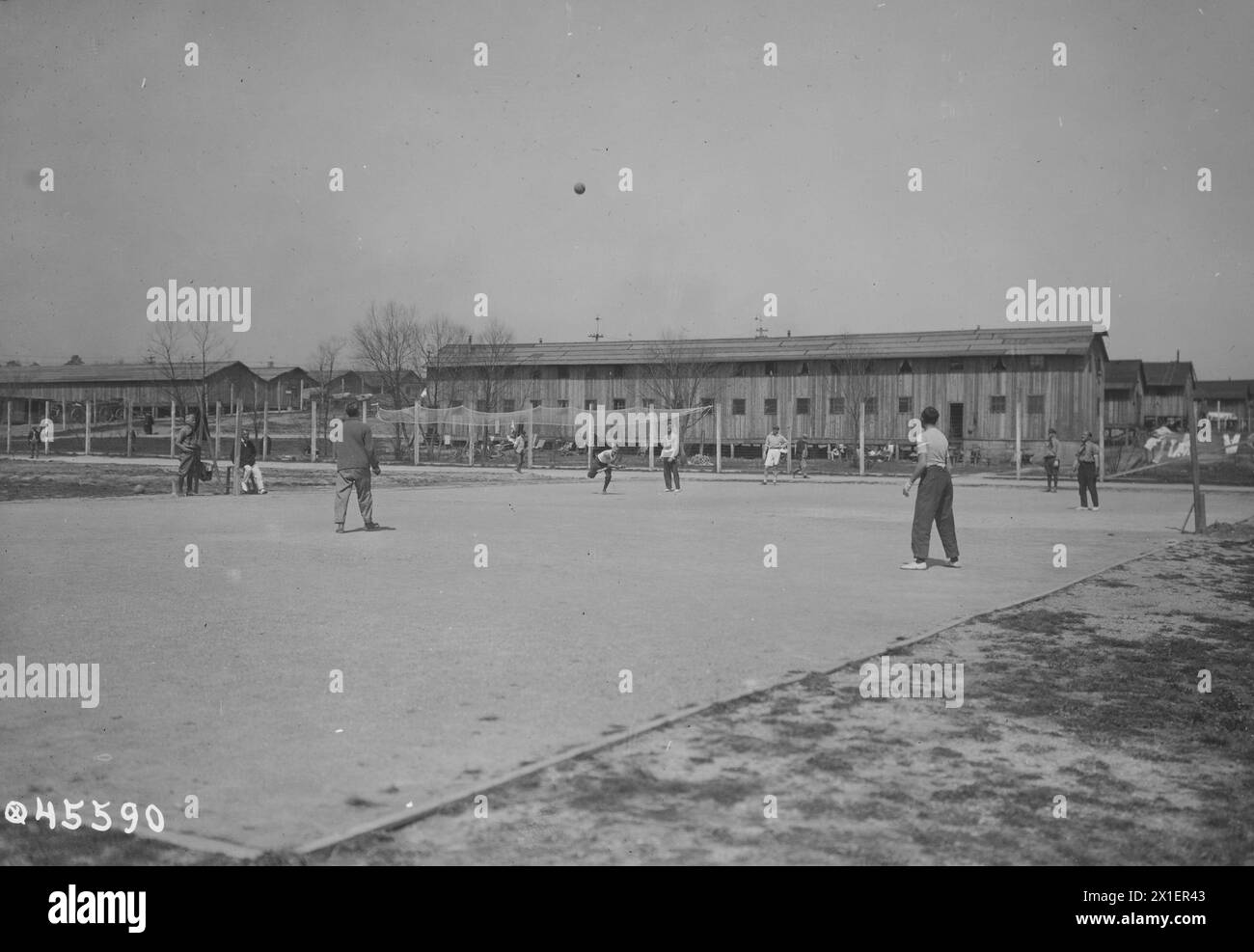 War prison barracks at Fort Oglethorpe, Ga. Their chief sport, volley ball. Picture shows ball in the air ca. May 1919 Stock Photo