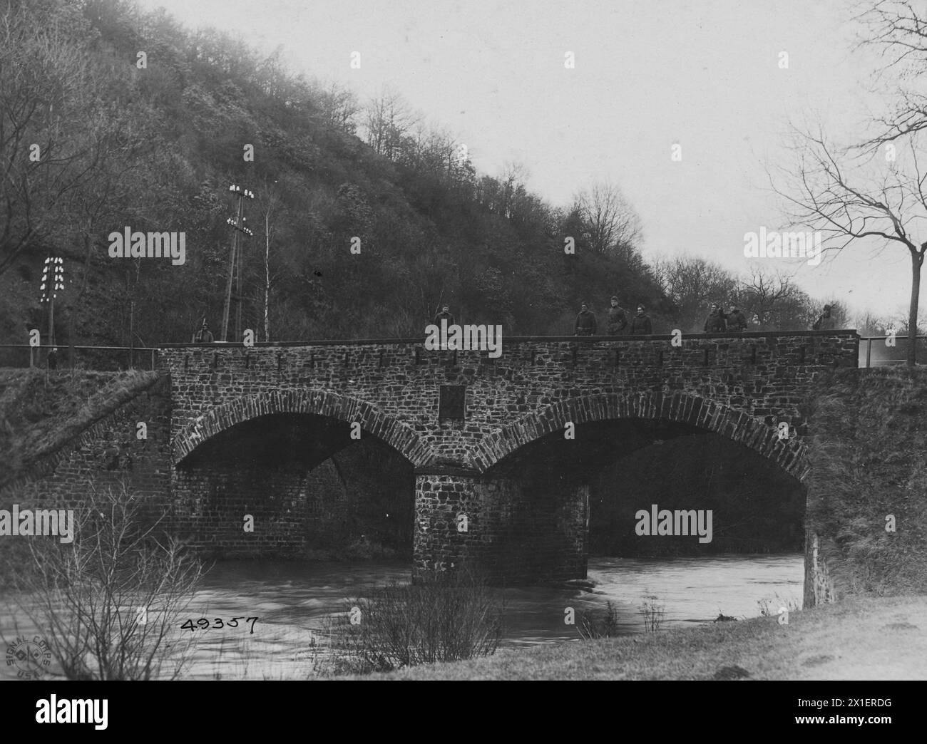 WW I Photos - Bridge over Weid River. Sentry 125th Infantry on guard to prevent passage of forces into neutral territory. American sentries station on both ends of the bridge near Oberlagr Germany ca. 1918-1919 Stock Photo