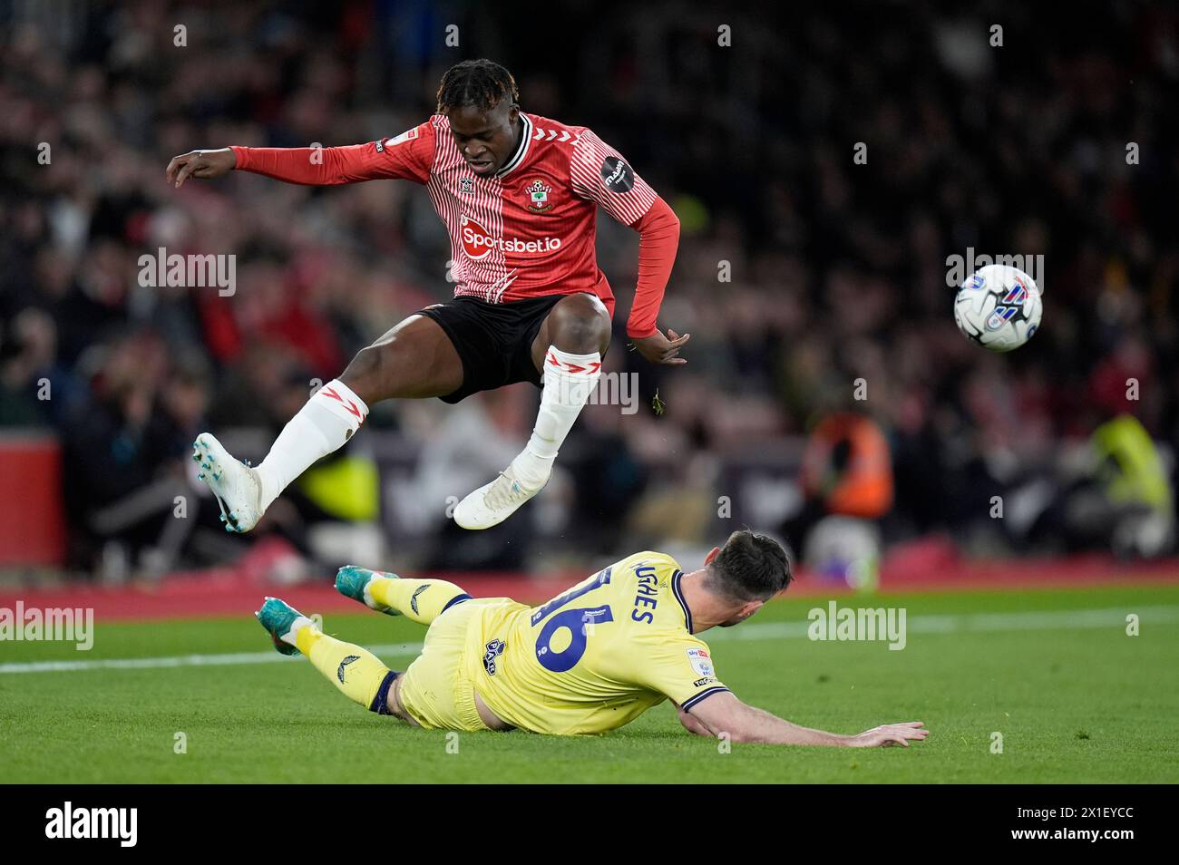 Southampton's Kamaldeen Sulemana (left) jumps over Preston North End's Andrew Hughes during the Sky Bet Championship match at St Mary's Stadium, Southampton. Picture date: Tuesday April 16, 2024. Stock Photo