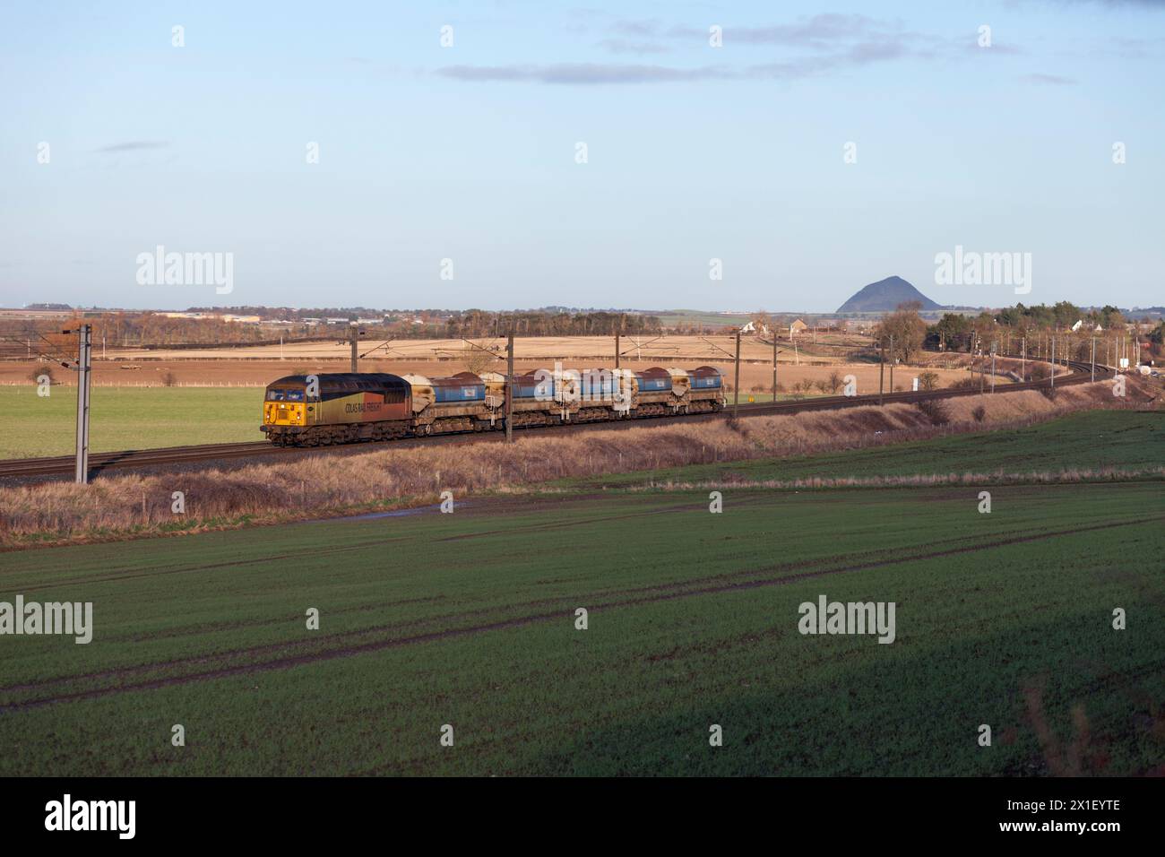 Colas Rail Freight class 56 diesel locomotive 56078 on the east coast mainline with a engineers of ballast hoppers Stock Photo