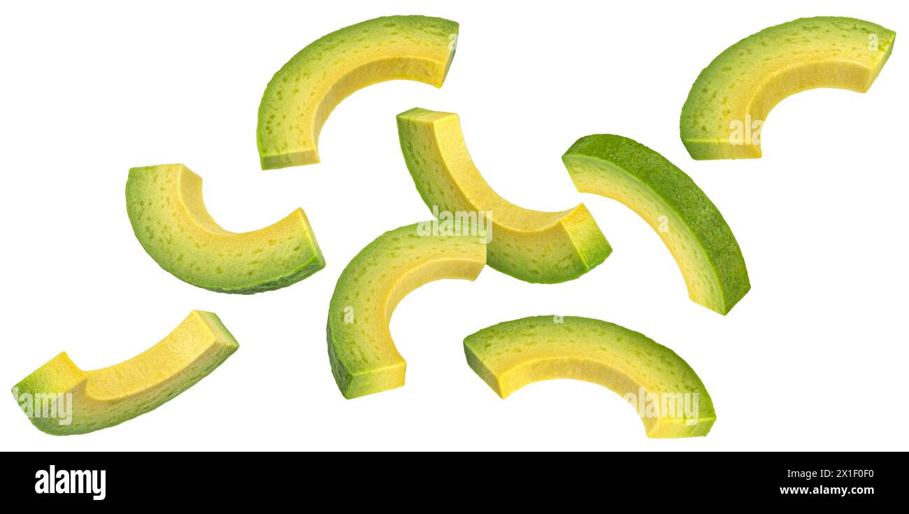 Falling avocado slices isolated on white background Stock Photo