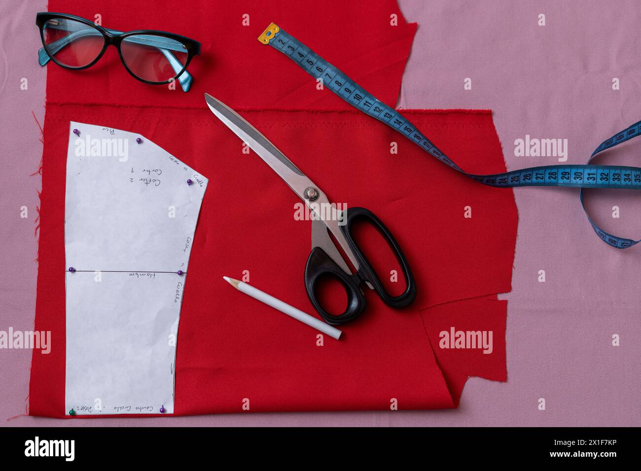 Sewing pattern with scissors and tape measure. Stock Photo