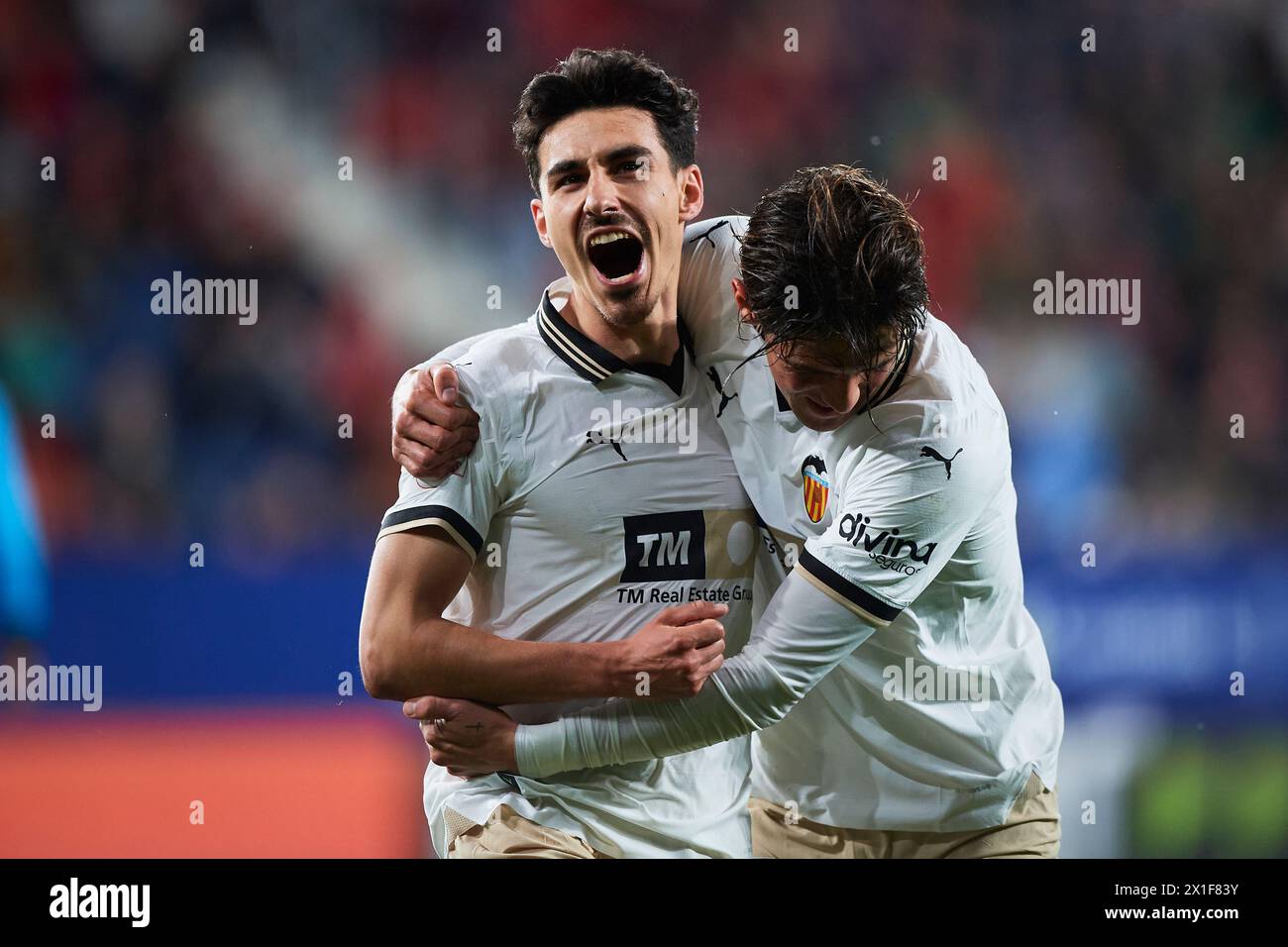 Andre Almeida of Valencia CF celebrates with his teammate Jesus Vazquez of Valencia CF after scoring the team's first goal during the LaLiga EA Sports Stock Photo