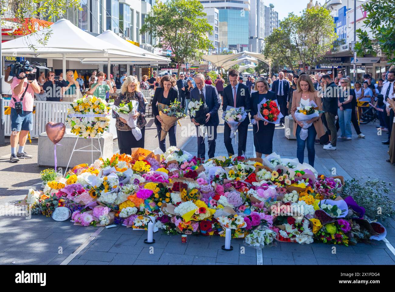 Sydney, Australia. 14 April 2024. Australian Prime Minister Anthony Albanese attends a wreath laying in Bondi Junction Mall for the victims of Joel Cauchi's knife attack in the Westfield Bondi Junction shopping centre that occurred on Saturday, 13 April 2024. Cauchi, 40, who suffered from mental health issues, died at the scene after being shot by police. Pictured (left to right): Paula Masselos (Mayor of Waverley), Allegra Spender (MP for the Electorate of Wentworth), Anthony Albanese (Prime Minister), Chris Minns (Premier of NSW), Coogee MP Marjorie O'Neill and MP for Vaucluse Kellie Sloane. Stock Photo