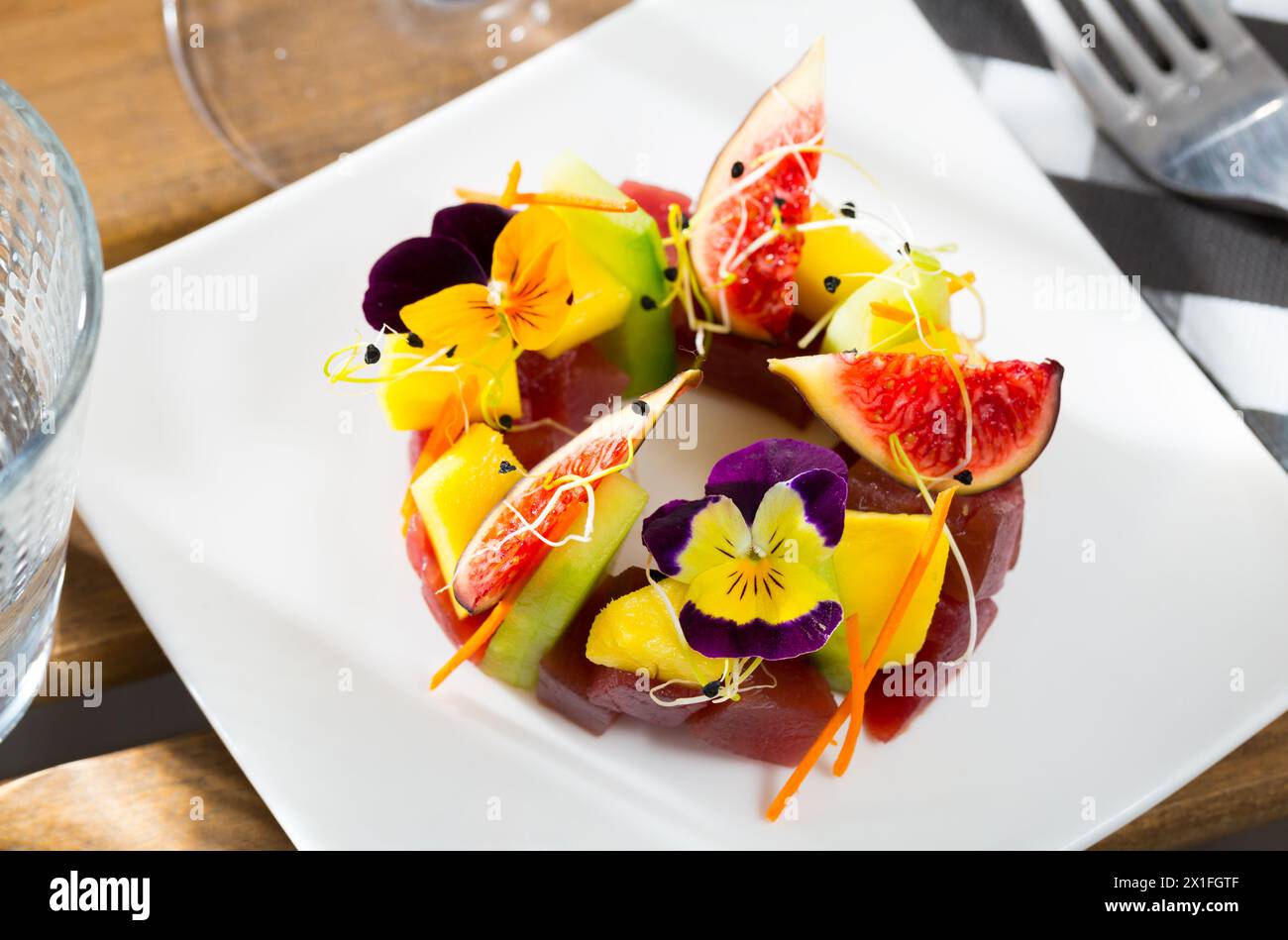 Raw tuna tartare with cucumber, figs Stock Photo Alamy