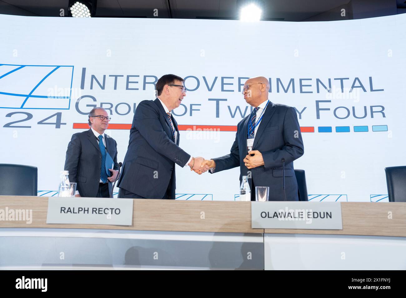 Philippines Finance Secretary Ralph Recto (L), Nigerian Finance Minister Olawale Edun (C) and G-24 Secretariat Iyabo Masha shakes hands after they held a press conference by the Intergovernmental Group of Twenty-Four on International Monetary Affairs and Development (G-24) during the IMF/World Bank Group Spring Meetings at the IMF Headquarters in Washington, DC on April 16, 2024. Stock Photo