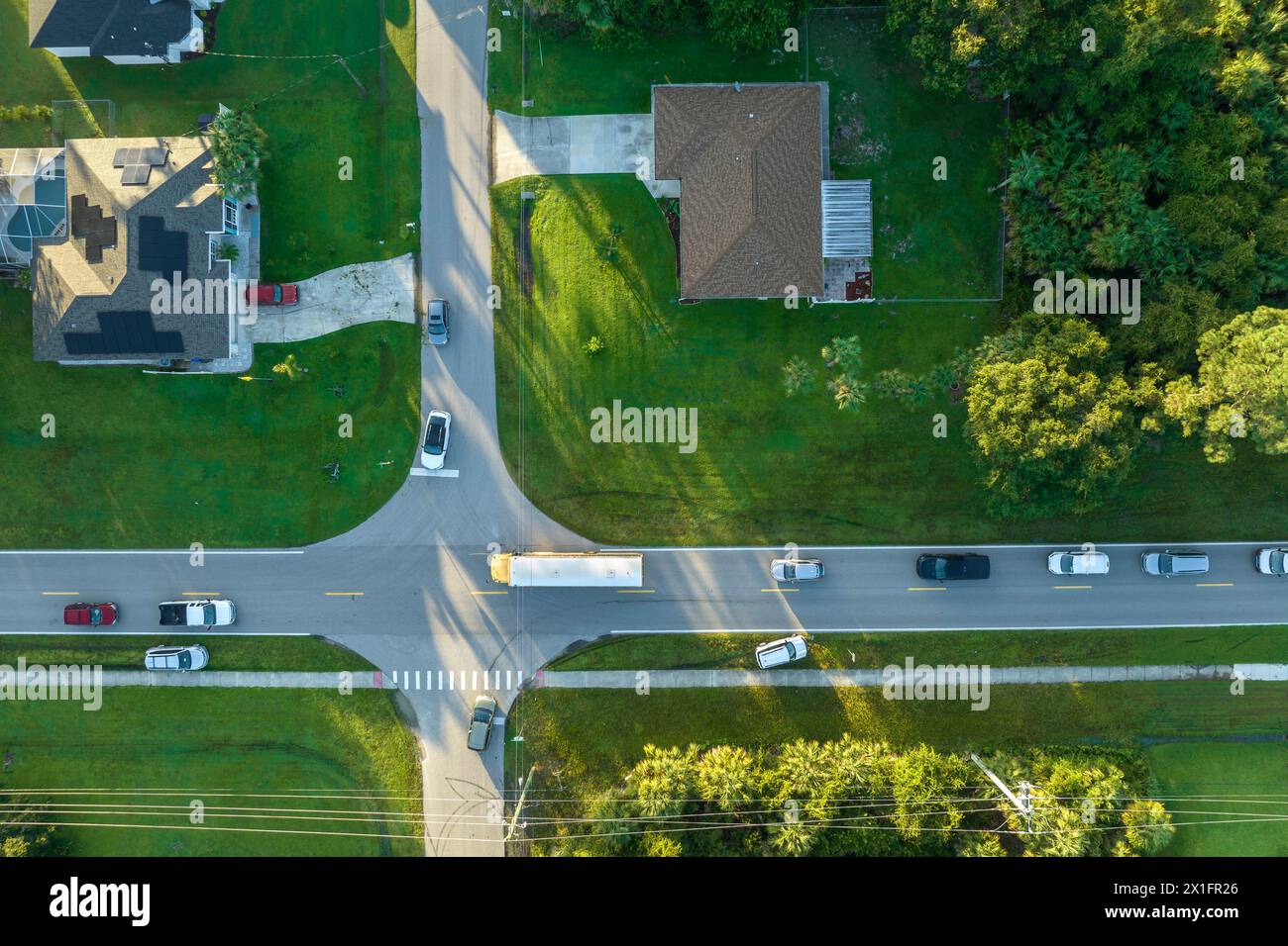 Aerial view of american yellow school bus picking up children at ...