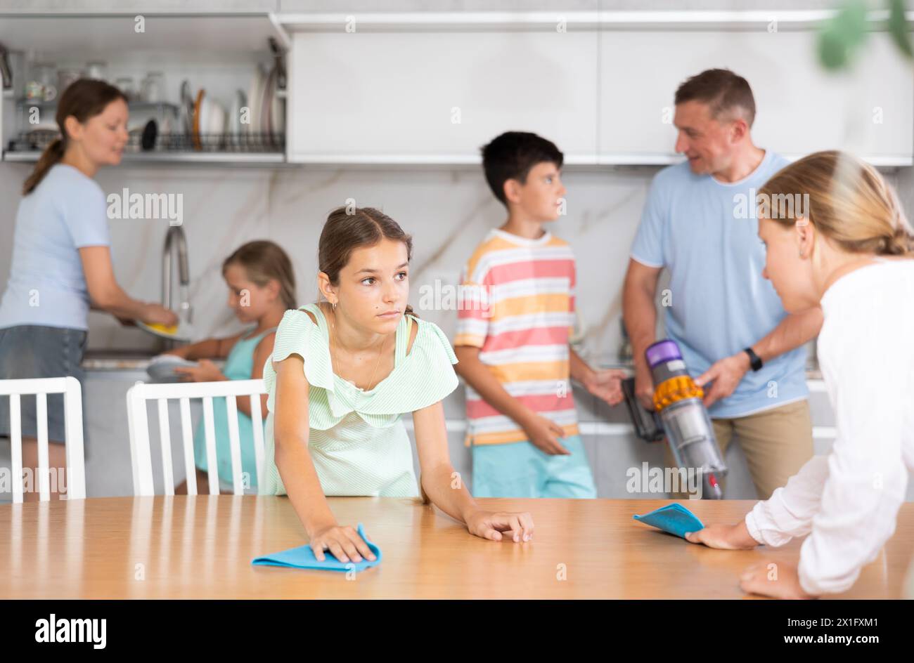 Help Family Children in large family help their parents to clean room Stock Photo ...