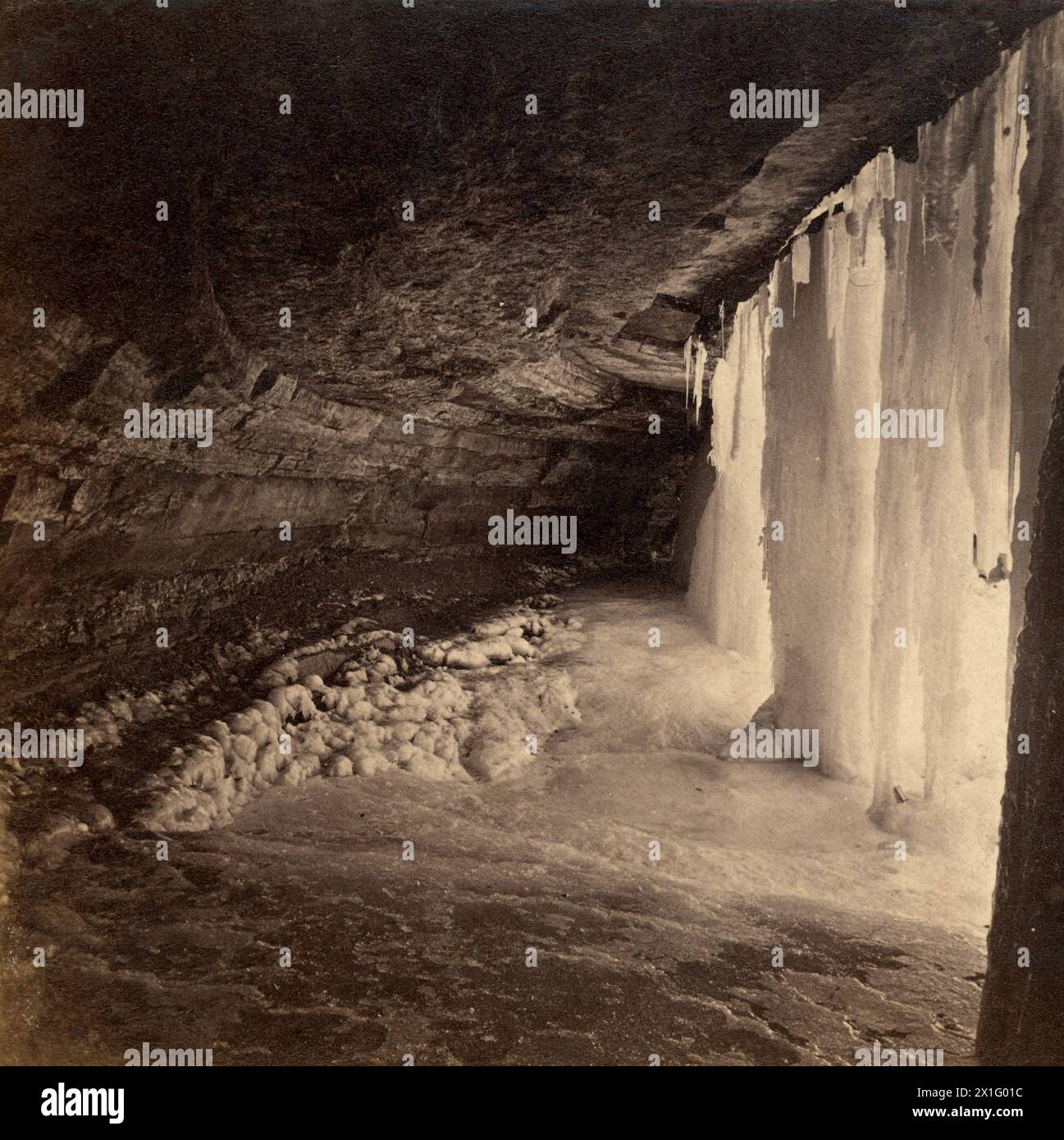 Ice cave at Minnehaha Falls in Minneapolis, Minnesota - Frame from antique stereoview photograph circa. latter 19th century - Albumen mounted print Stock Photo