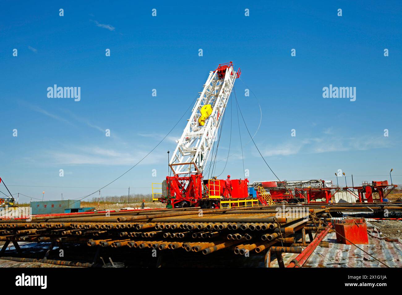 Oil pipe and oil drilling rig equipment Stock Photo