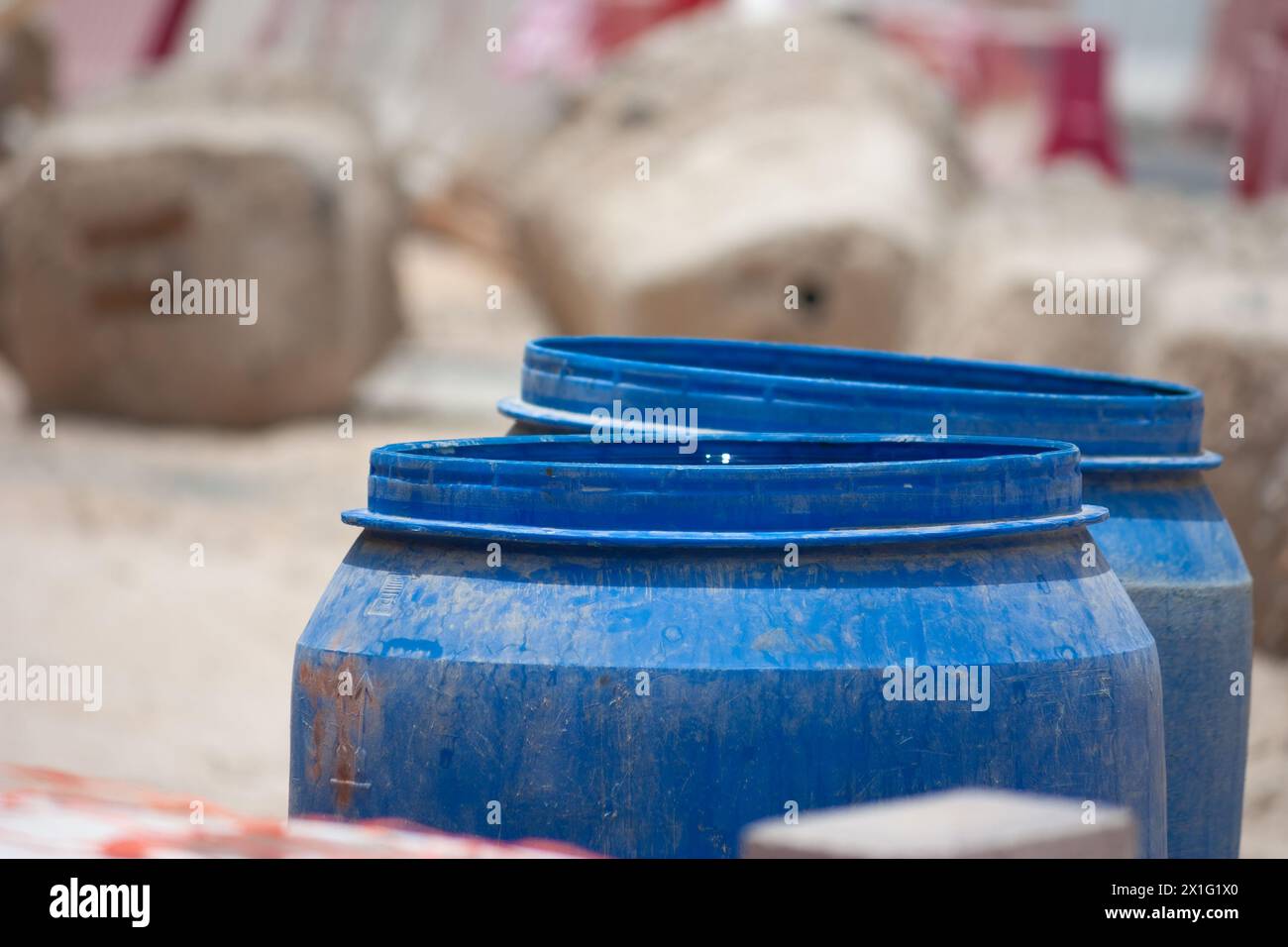 Blue buckets in an industrial setting Stock Photo