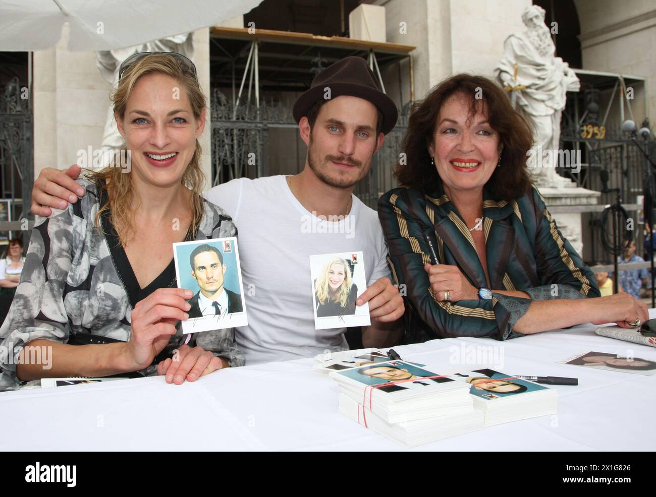 Clemens Schick (Death at Jedermann), Sophie von Kessel (Buhlschaft at Jedermann) and Elisabeth Trissenaar (Jedermanns mother, former Buhlschaft) give autographs on the  Jedermann stage during an opening party of the Salzburg Festival at the Domplatz, 26th July 2008. - 20080726 PD0444 - Rechteinfo: Rights Managed (RM) Stock Photo