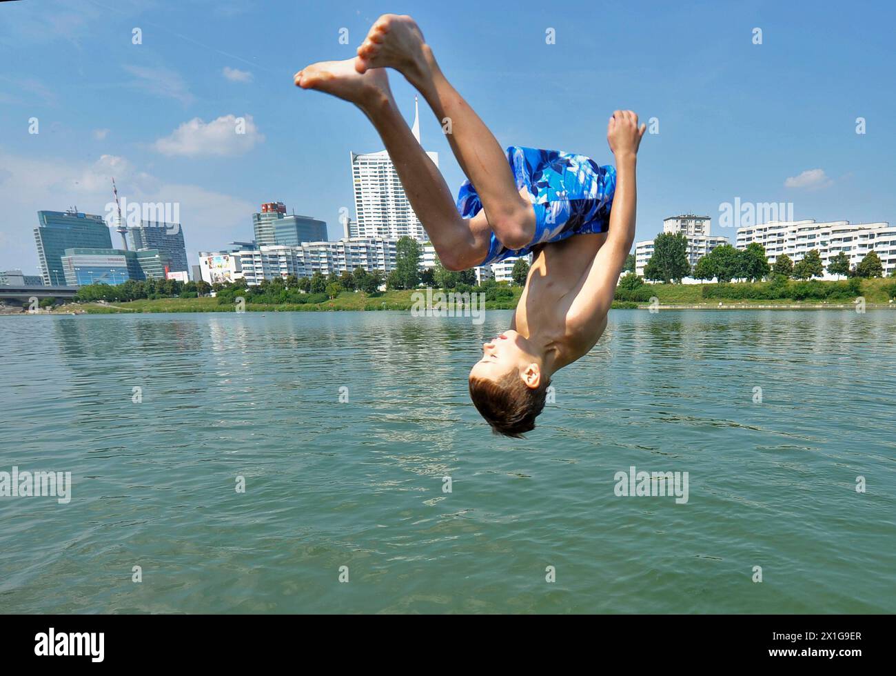 Boy diving into the river new Danube in Vienna, captured on 2 July 2010. In Vienna, Lower Austria and Burgenland the summer holidays start for the pupils with sunshine and high temperatures. - 20100702 PD1764 - Rechteinfo: Rights Managed (RM) Stock Photo