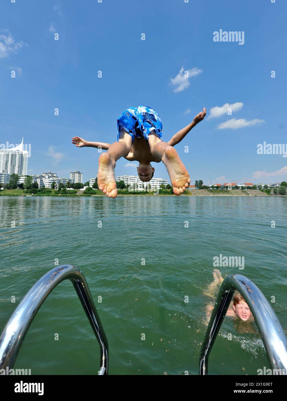 Boy diving into the river new Danube in Vienna, captured on 2 July 2010. In Vienna, Lower Austria and Burgenland the summer holidays start for the pupils with sunshine and high temperatures. - 20100702 PD1793 - Rechteinfo: Rights Managed (RM) Stock Photo