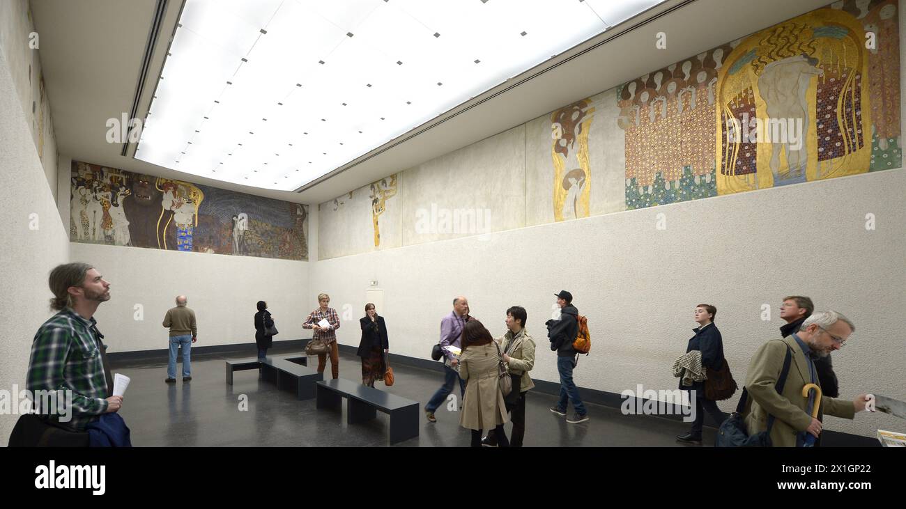 Visitors look at the 'Beethovenfries', a 34 meter long Installation by Gustav Klimt dedicated to the composer Ludwig van Beethoven, in an especially setup room inside the Secession builidng in Vienna, Austria, 16 October 2013. According to media reports heirs of the Austrian-jewish family Lederer applied for restitution of the artwork to the Austrian Ministry of Culture on 15 October 2013. - 20131016 PD2945 - Rechteinfo: Rights Managed (RM) Stock Photo