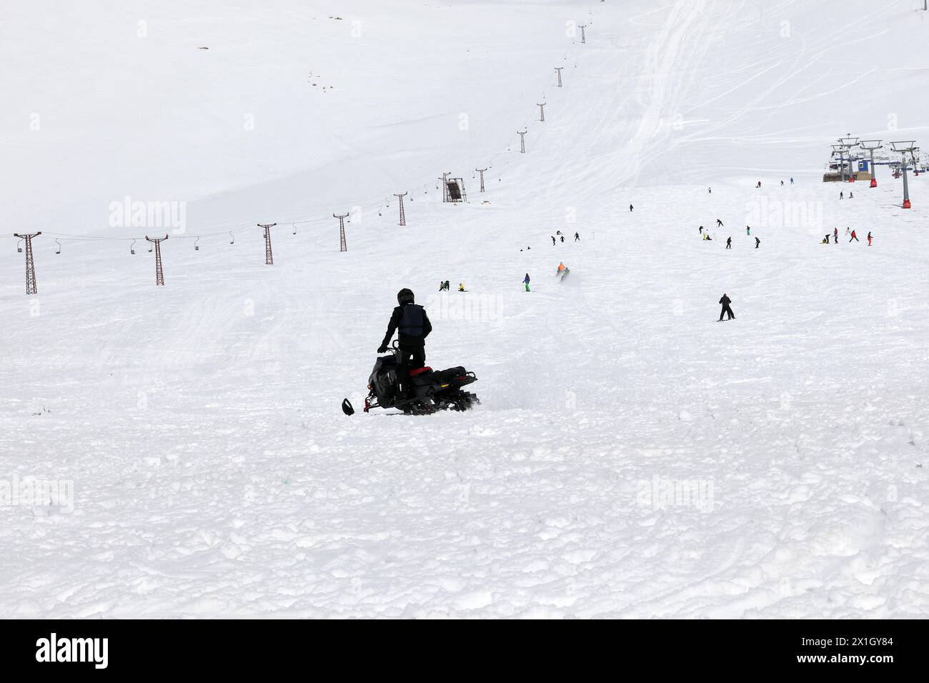 A man riding a skidoo in the snowy slopes of Lebanon. Stock Photo