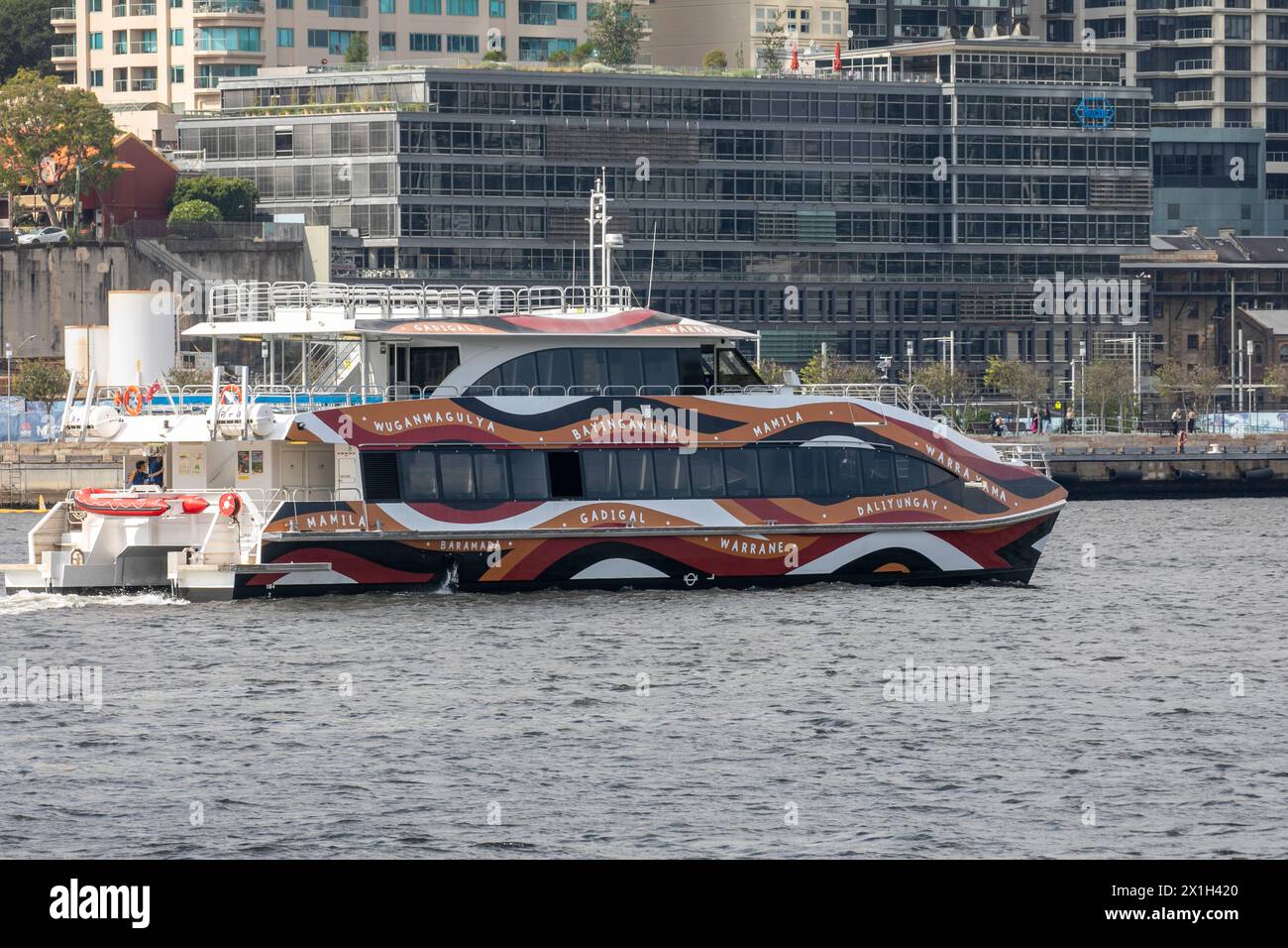 Sydney whale watching vessel, Ocean Dreaming 2, which is wrapped by Warwick Keen wave design representing aboriginal clans around Sydney Harbour Stock Photo