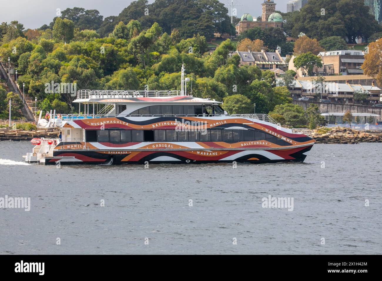 Sydney whale watching vessel, Ocean Dreaming 2, which is wrapped by Warwick Keen wave design representing aboriginal clans around Sydney Harbour Stock Photo