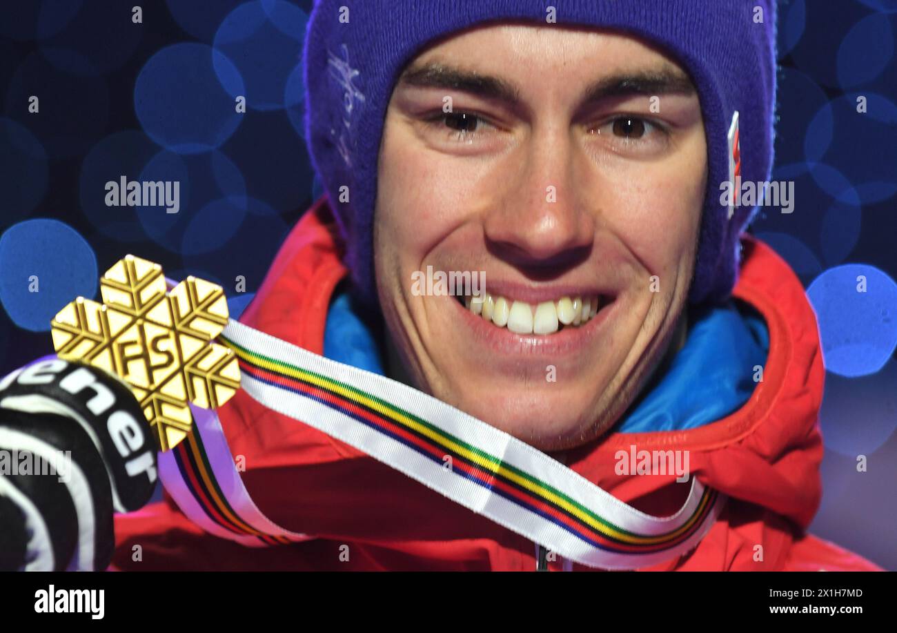 Gold medal winner Stefan Kraft of Austria celebrate his medals at austria house for the HS110