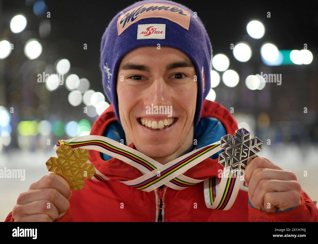 Gold medal winner Stefan Kraft of Austria celebrate his medals at austria house for the HS110