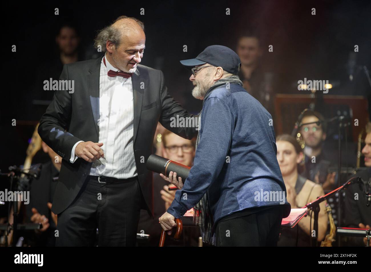 British singer Phil Collins (L) is receiving a honorary doctorate of the University of Music and Performing Arts Graz and a traditional Austrian hat by the University's Senator Wolfgang Hattinger on May 22, 2019 in Graz. - 20190522 PD8702 - Rechteinfo: Rights Managed (RM) Stock Photo