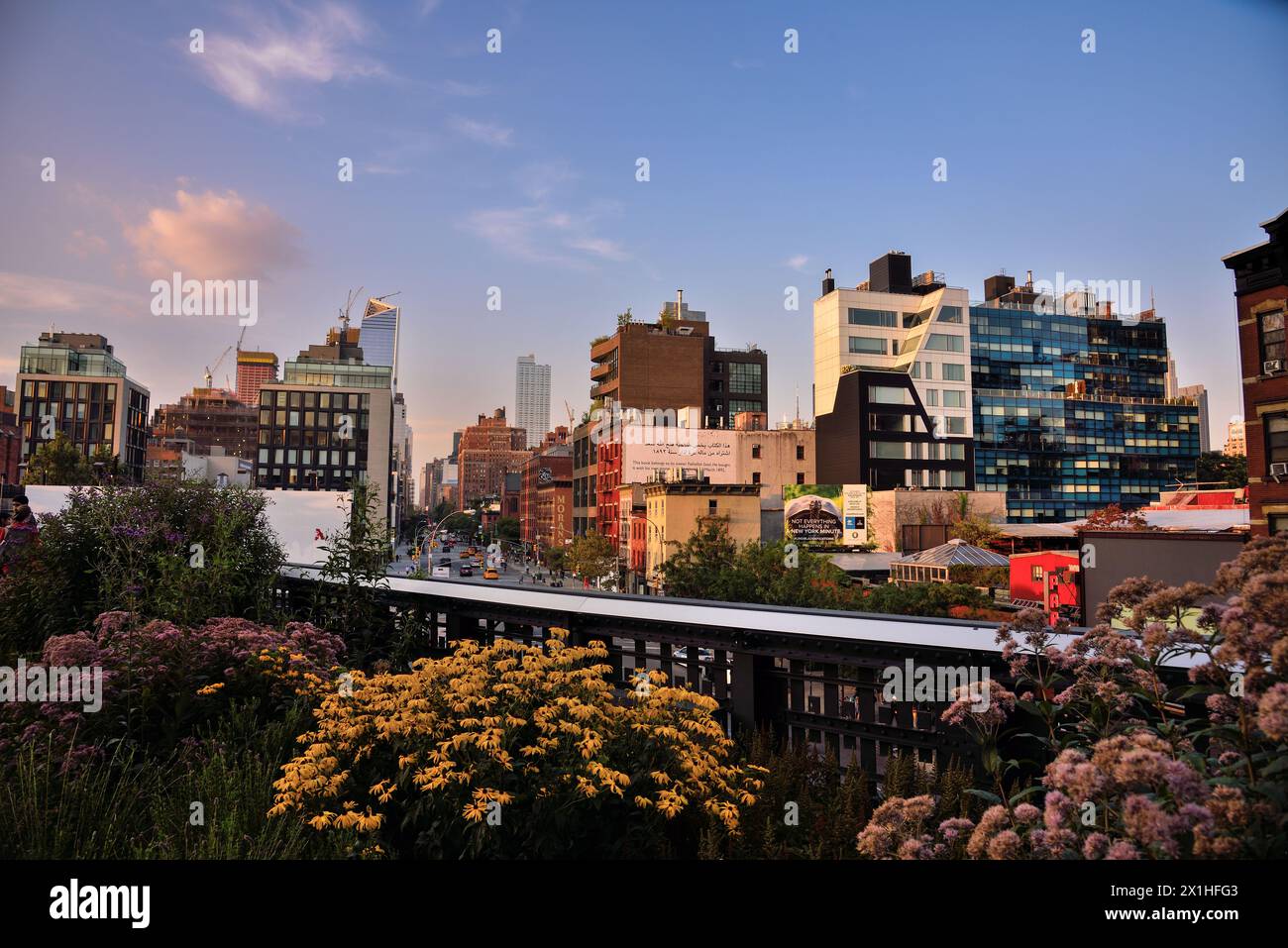 View from the High Line Park to the Buildings of 10th Ave at Dusk - Manhattan, New York City Stock Photo