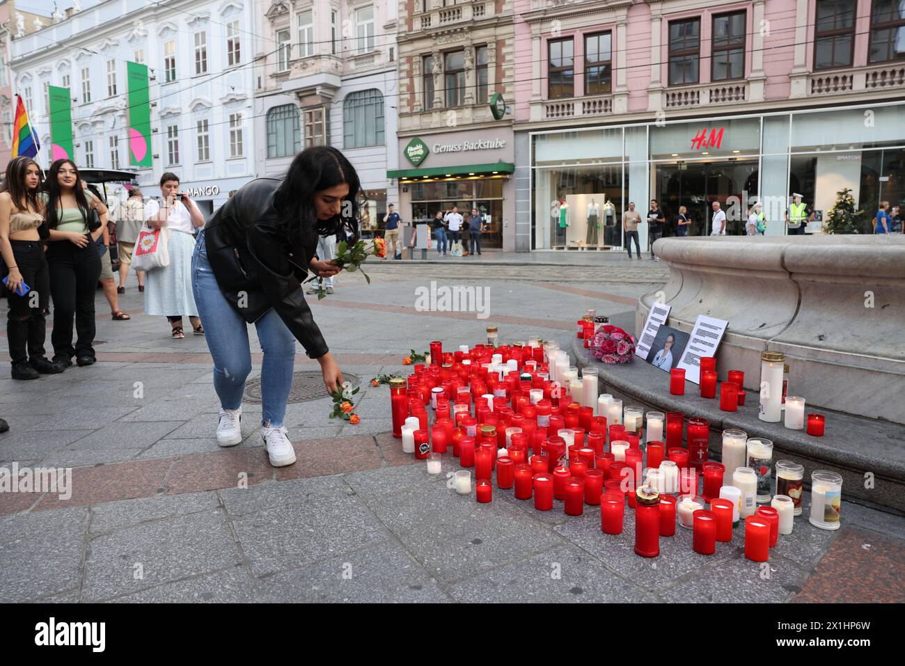 People attend a candle light memorial organised by initiative '# ...