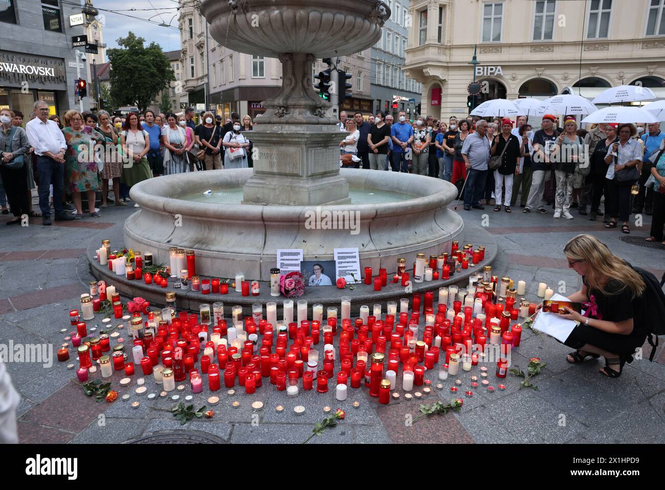 People attend a candle light memorial organised by initiative '# ...