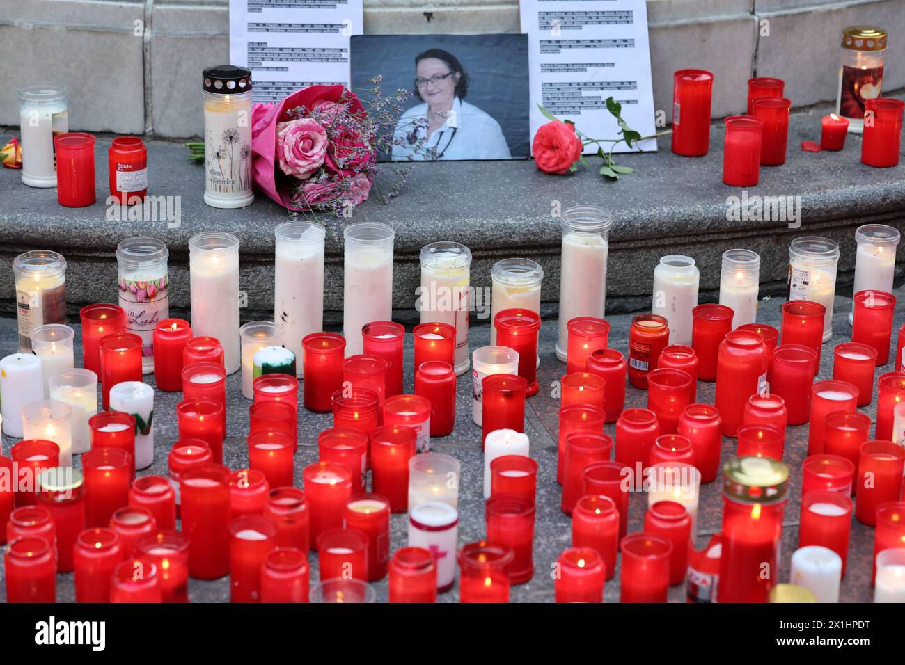People attend a candle light memorial organised by initiative '# ...