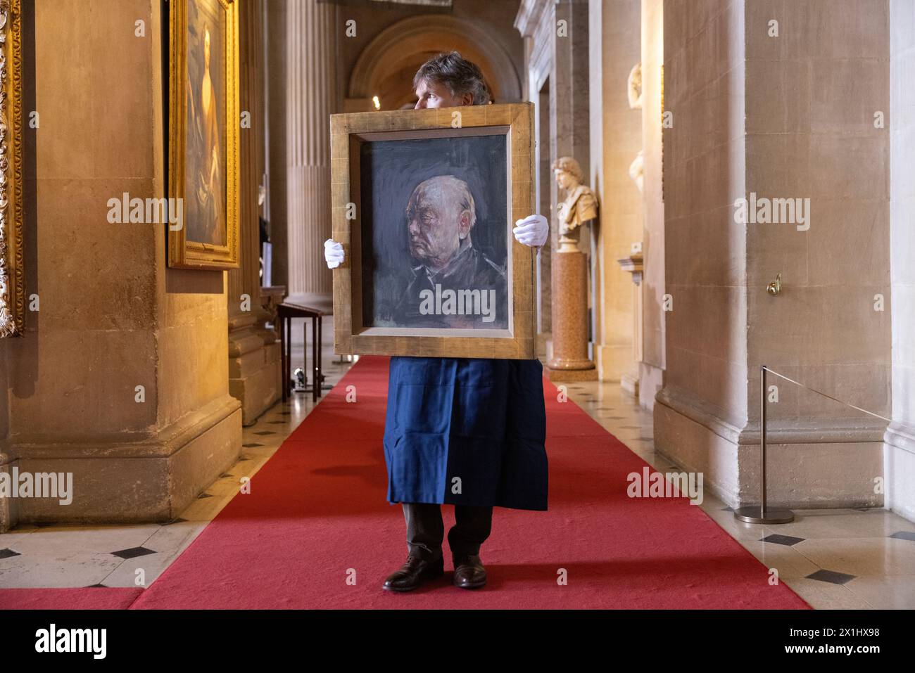 Sotheby's staff holds a portrait of the former British prime minister Winston Churchill, painted by Graham Sutherland in 1954, Blenheim Palace, UK Stock Photo