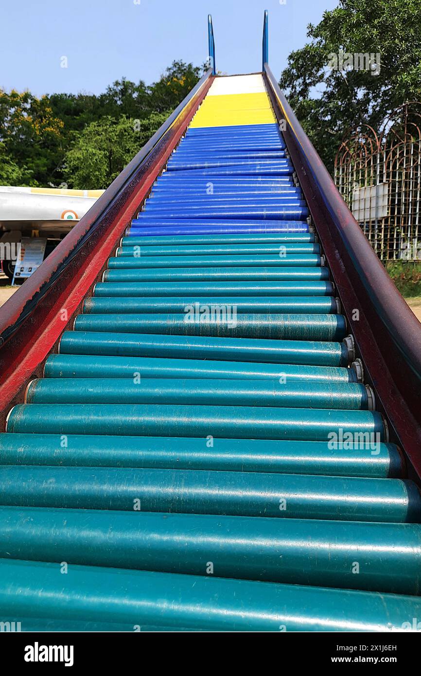 View of multi-colored rollers of slide at park in Periyar Science and