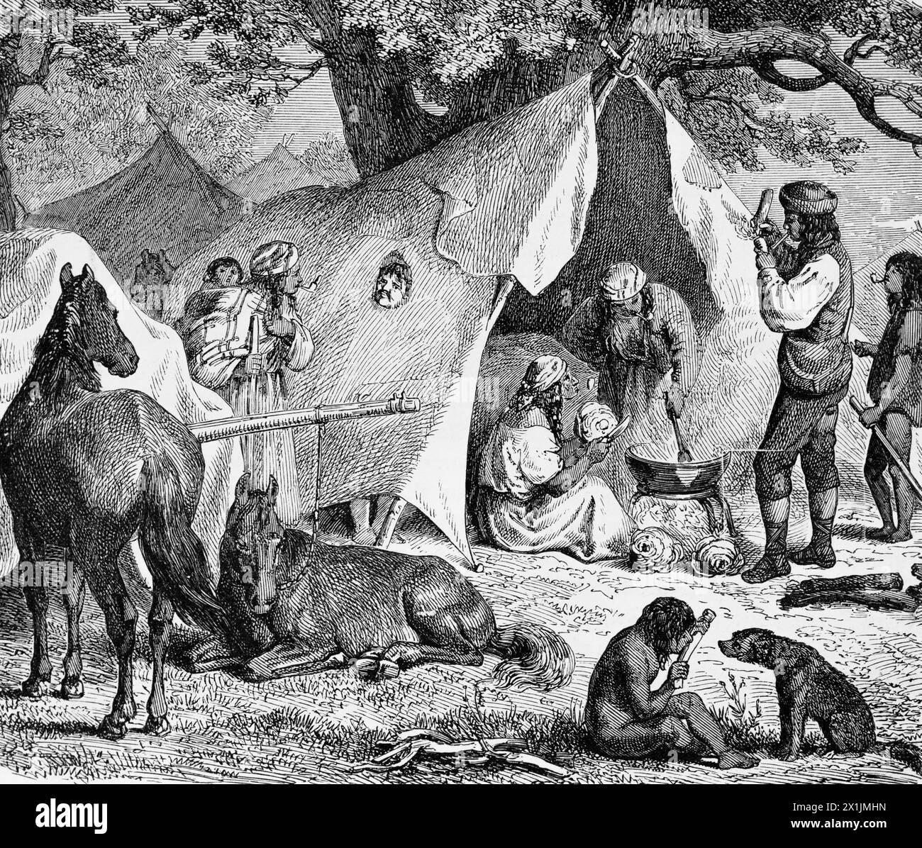 In a gypsy camp,women preparing a meal, man smoking a pipe, children playing, historic illustration 1880 Stock Photo