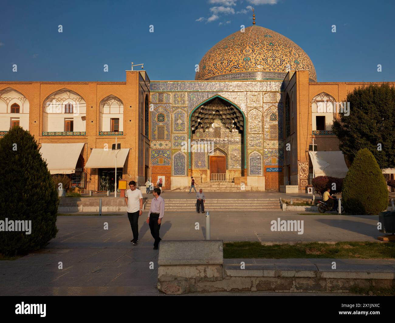 People walk at the Lotfollah Mosque in Naqsh-e Jahan Square. Isfahan, Iran. Stock Photo