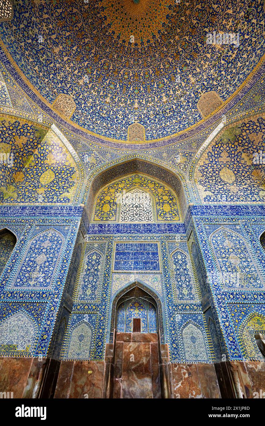 Mihrab (a niche in the wall indicating the direction of Mecca) in the main prayer hall in the Shah Mosque (Masjed-e Shah). Isfahan, Iran. Stock Photo