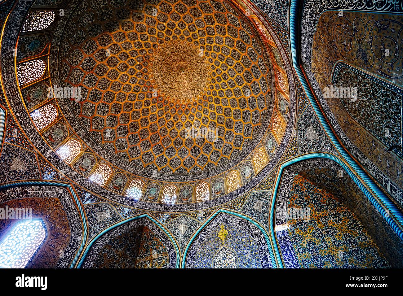 View from below of domed ceiling in the Shah Mosque (Masjed-e Shah) with its elaborate tiling. Isfahan, Iran. Stock Photo