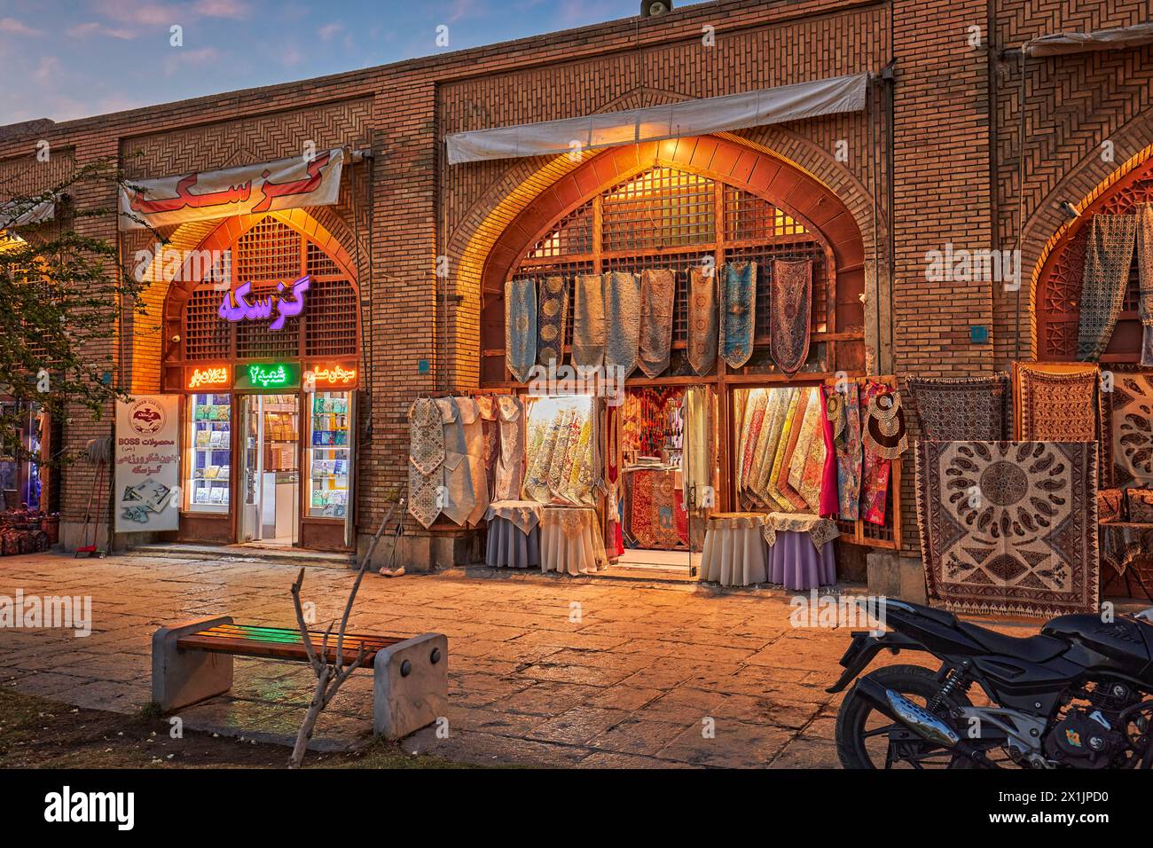 Windows of handicraft shops in Naqsh-e Jahan Square illuminated at dusk. Isfahan, Iran. Stock Photo